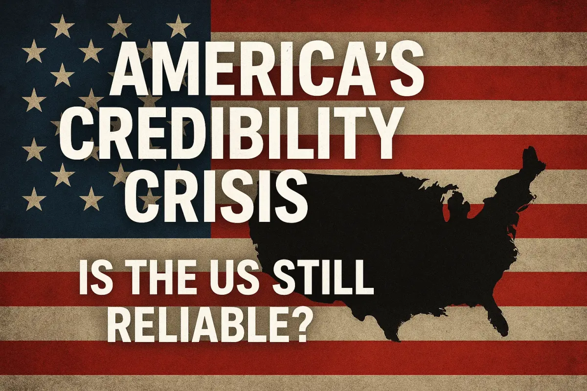 Image of the U.S. flag with a black silhouette map of America and the text “America’s Credibility Crisis – Is the US Still Reliable?” highlighting questions over U.S. global reliability.