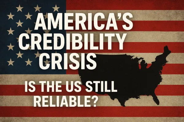 Image of the U.S. flag with a black silhouette map of America and the text “America’s Credibility Crisis – Is the US Still Reliable?” highlighting questions over U.S. global reliability.